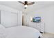 Bright bedroom with a white dresser, a television, and neutral walls at 9255 E Lehigh Ave # 208, Denver, CO 80237