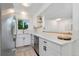 Updated kitchen with white cabinets, stainless steel appliances, and stylish backsplash at 9255 E Lehigh Ave # 208, Denver, CO 80237