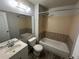 Bathroom with a shower and tub combination, updated fixtures, and a white vanity at 8491 W Star Cir, Littleton, CO 80128