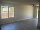 Bright living room featuring new wood floors, fresh paint, a ceiling fan, and lots of natural light at 8491 W Star Cir, Littleton, CO 80128