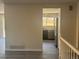 Living room featuring wood flooring, fresh paint, and an open concept floor plan to the kitchen at 8491 W Star Cir, Littleton, CO 80128