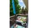 Relaxing balcony with comfortable seating, colorful cushions, and a stylish outdoor umbrella for shade at 1470 S Quebec Way # 245, Denver, CO 80231