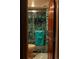 This tiled bathroom showcases a glass shower and a matching toilet at 1470 S Quebec Way # 245, Denver, CO 80231