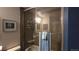 Well-lit bathroom featuring a glass enclosed shower with tile surround and a modern towel rack at 1470 S Quebec Way # 245, Denver, CO 80231