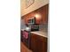 This open kitchen features stainless steel appliances, tile backsplash, and bright countertops at 1470 S Quebec Way # 245, Denver, CO 80231