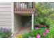 Image shows under-deck area surrounded by a garden featuring a variety of colorful flowers and plants at 1470 S Quebec Way # 245, Denver, CO 80231