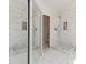 Beautiful bathroom with marble tile and two glass door showers at 1123 Oakhurst Dr, Broomfield, CO 80020