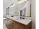 Large bathroom with a double sink vanity, an oversized mirror, and a soaking tub at 1123 Oakhurst Dr, Broomfield, CO 80020