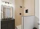 Sleek bathroom with a textured vanity, unique shower, and modern fixtures at 1123 Oakhurst Dr, Broomfield, CO 80020