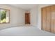 Neutral bedroom with large window and closet at 1123 Oakhurst Dr, Broomfield, CO 80020