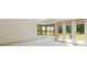 Spacious bedroom with bright windows showcasing golf course views and balcony access at 1123 Oakhurst Dr, Broomfield, CO 80020