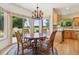Charming breakfast nook with scenic views and a chandelier at 1123 Oakhurst Dr, Broomfield, CO 80020