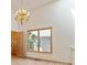 Bright dining room with hardwood floors, chandelier, and large windows, ideal for Gathering meals at 1123 Oakhurst Dr, Broomfield, CO 80020