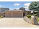 Charming two-story home featuring a brick facade, three-car garage, and well-maintained landscaping at 1123 Oakhurst Dr, Broomfield, CO 80020