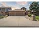 Charming two-story home featuring a brick facade, three-car garage, and well-maintained landscaping at 1123 Oakhurst Dr, Broomfield, CO 80020
