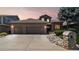 Charming two-story home featuring a brick facade, three-car garage, and well-maintained landscaping at 1123 Oakhurst Dr, Broomfield, CO 80020