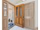 Bright foyer with tile flooring, an elegant front door, and an open view into the home's interior at 1123 Oakhurst Dr, Broomfield, CO 80020