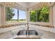 Kitchen sink with view of yard at 1123 Oakhurst Dr, Broomfield, CO 80020