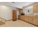 Well-equipped kitchen with plenty of counter space, cabinetry, and a microwave at 1123 Oakhurst Dr, Broomfield, CO 80020