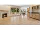 Living room with hardwood floors, fireplace, and a breakfast nook at 1123 Oakhurst Dr, Broomfield, CO 80020