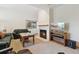 Cozy living room with fireplace, comfortable seating, and a television for entertainment at 1123 Oakhurst Dr, Broomfield, CO 80020