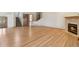 Spacious living room features hardwood floors and a cozy fireplace at 1123 Oakhurst Dr, Broomfield, CO 80020