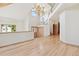 Bright and airy living room featuring hardwood floors, high ceilings, and large windows for natural light at 1123 Oakhurst Dr, Broomfield, CO 80020