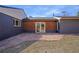 Backyard featuring a stone patio with a home exterior that has wooden sidings at 5730 E 19Th Ave, Denver, CO 80220