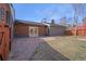 Spacious backyard with stone patio, new landscaping and secure wooden fence, great for outdoor living and entertaining at 5730 E 19Th Ave, Denver, CO 80220