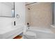 Stylish bathroom with modern fixtures, decorative tile, and a shower-tub combination at 5730 E 19Th Ave, Denver, CO 80220