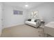 Bright, modern bedroom features a gray daybed, light neutral walls, and large window at 5730 E 19Th Ave, Denver, CO 80220