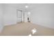 Bright bedroom features neutral carpet and a mirrored closet with open door to another room at 5730 E 19Th Ave, Denver, CO 80220