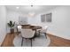 Charming dining area featuring a round table, modern lighting, and elegant decor accents at 5730 E 19Th Ave, Denver, CO 80220