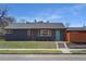 Charming home has a freshly manicured lawn and painted brick at 5730 E 19Th Ave, Denver, CO 80220