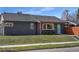 Beautifully landscaped home with a freshly painted exterior and manicured lawn at 5730 E 19Th Ave, Denver, CO 80220