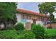 Beautiful exterior of a library with landscaping, mature trees, and red tiled roof at 5730 E 19Th Ave, Denver, CO 80220