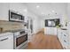 Beautiful modern kitchen with stainless steel appliances, sleek countertops, and ample cabinet space at 5730 E 19Th Ave, Denver, CO 80220
