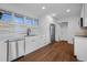 Modern kitchen with stainless steel appliances, white cabinetry, and stainless steel sink at 5730 E 19Th Ave, Denver, CO 80220