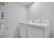 Well-lit laundry room featuring a modern washer and dryer set at 5730 E 19Th Ave, Denver, CO 80220