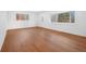 Spacious living room displaying gleaming hardwood floors and a large window for ample light at 5730 E 19Th Ave, Denver, CO 80220