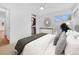 Bright main bedroom showcasing closet space, neutral decor, and comfortable furnishings for a relaxing retreat at 5730 E 19Th Ave, Denver, CO 80220