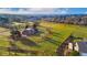 Expansive home with land, mature trees, green lawn, outbuildings and a long driveway at 5800 W Bowles Ave, Littleton, CO 80123