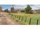 Charming property with a rustic fence and mature trees, offering a peaceful and secluded environment at 5800 W Bowles Ave, Littleton, CO 80123