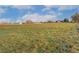 Expansive field with a clear view of the sky, perfect for outdoor activities and enjoying nature at 5800 W Bowles Ave, Littleton, CO 80123