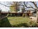 Large backyard featuring grass, a garden, mature trees, and wooden fence at 4269 Carter Trl, Boulder, CO 80301