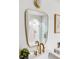 Modern bathroom features gold fixtures, square mirror, and a glass door shower with rain shower head at 4269 Carter Trl, Boulder, CO 80301