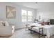 Bright bedroom featuring a large window, a comfortable queen-size bed, and minimalist decor at 4269 Carter Trl, Boulder, CO 80301