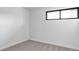 Clean and simple bedroom with a neutral carpet and a window providing natural light at 4269 Carter Trl, Boulder, CO 80301