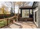 Wooden deck outside a home featuring access to backyard and sunroom at 4269 Carter Trl, Boulder, CO 80301