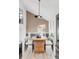 A dining area with statement wood accent wall, modern decor, and bright, natural light at 4269 Carter Trl, Boulder, CO 80301